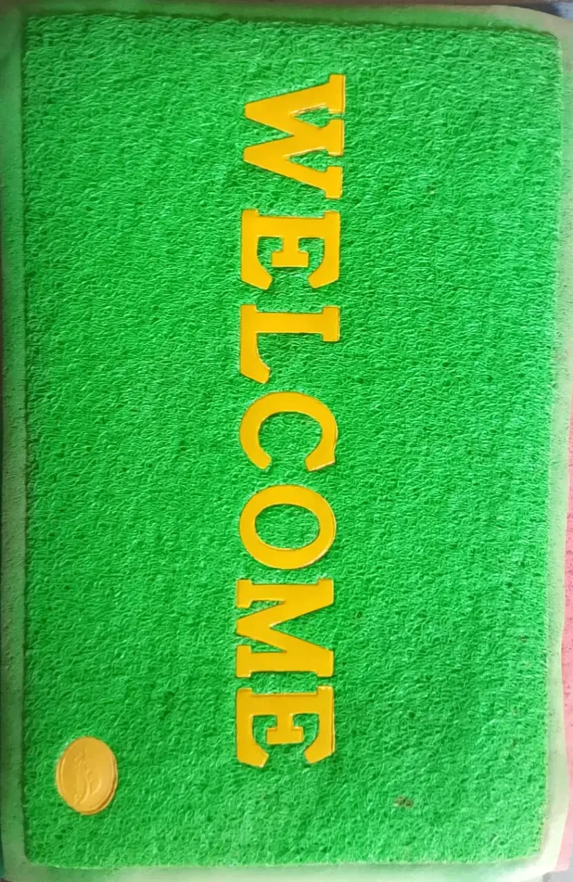 Green rectangular doormat with yellow WELCOME text