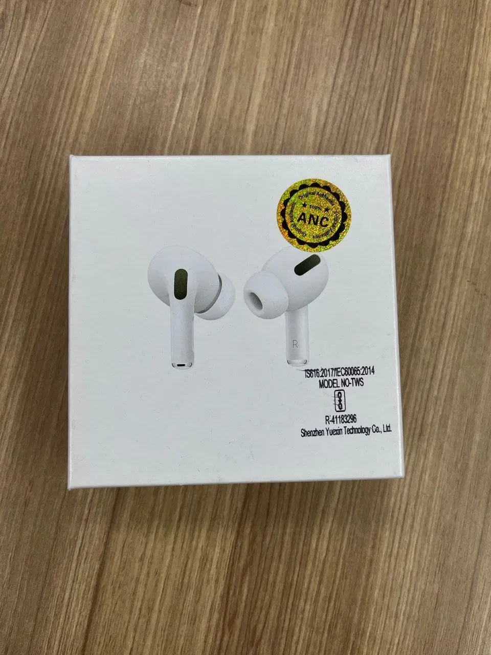 boAt T12 Max true wireless earbuds retail boxes in black, pink and green variants on green grass