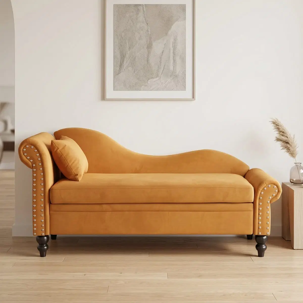 Front view of mustard velvet chaise bench with curved back, rolled arms, nailhead trim and black legs