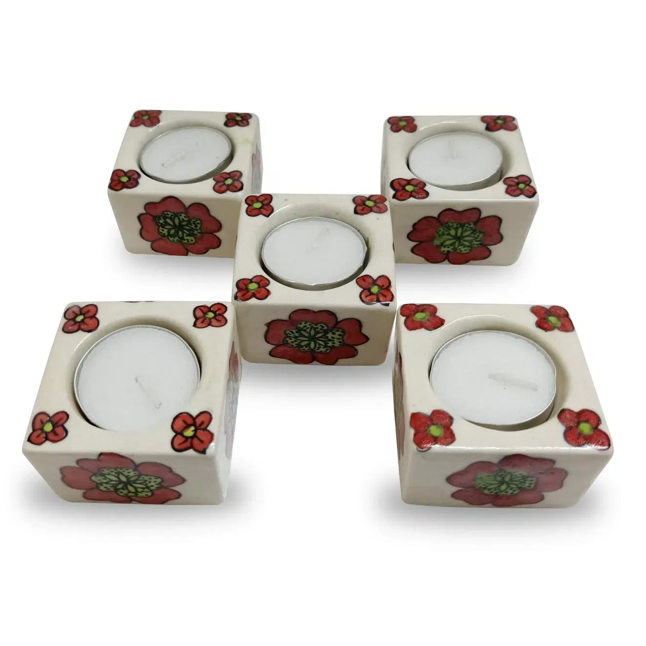 Two cream ceramic cube tealight holders arranged together, each with red flower motifs and white tealights