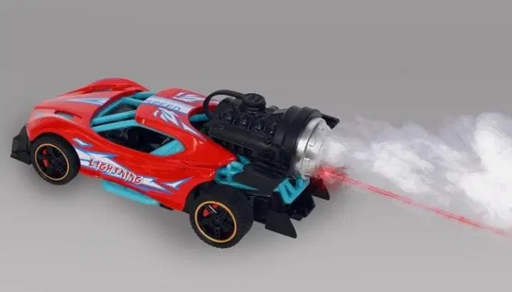 Red toy sports car with rear smoke effect and red light beam, shown in angled side view