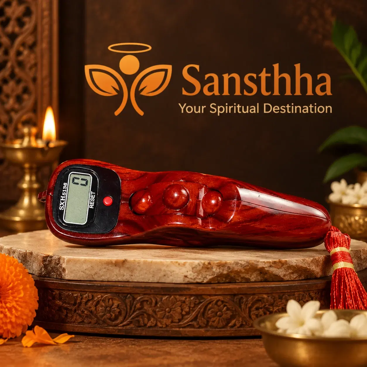 Glossy maroon finger counter displayed on a carved pedestal, showing three bead-like bumps and red tassel