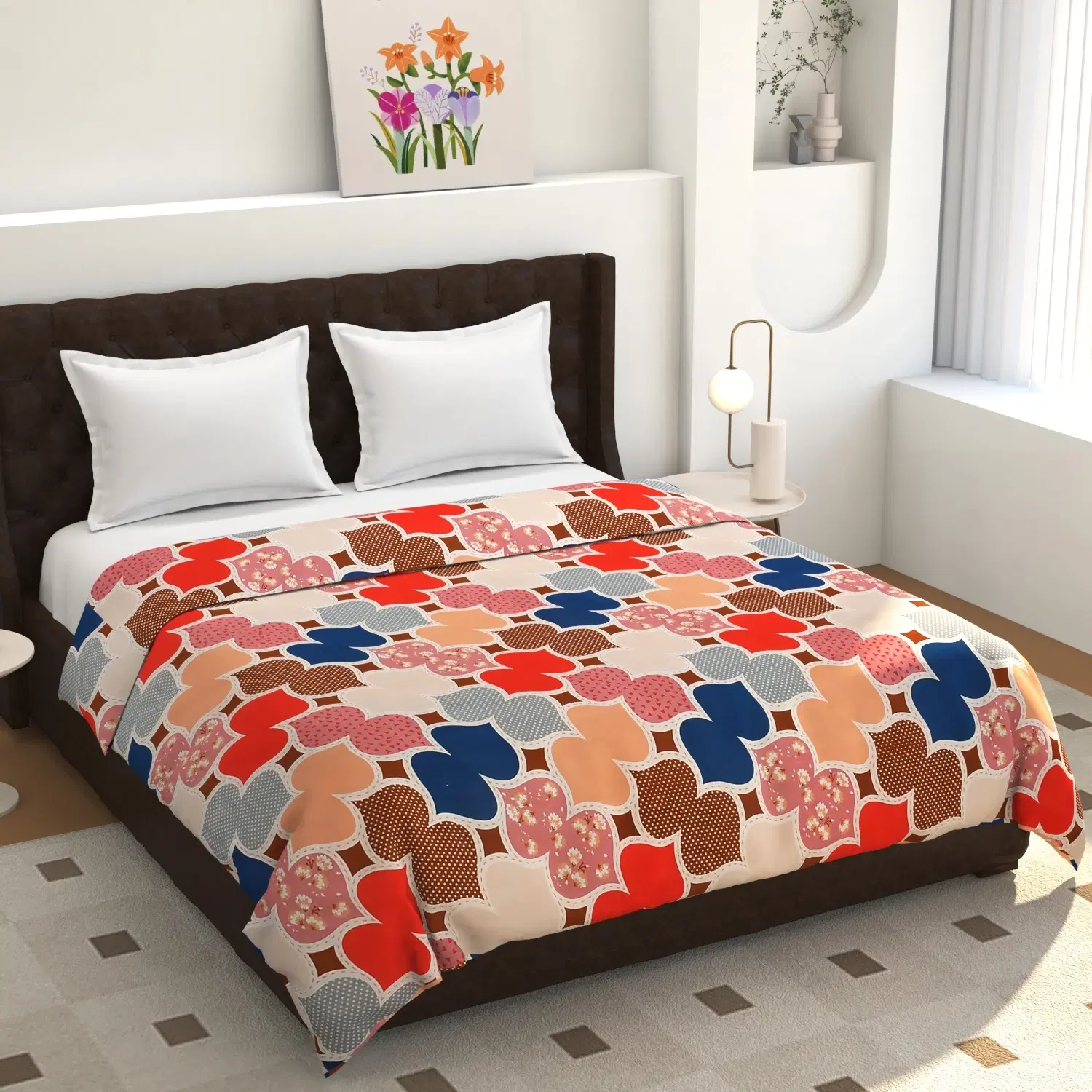 Multicolor patterned bed blanket spread on a double bed with red, blue, peach and brown geometric floral motifs