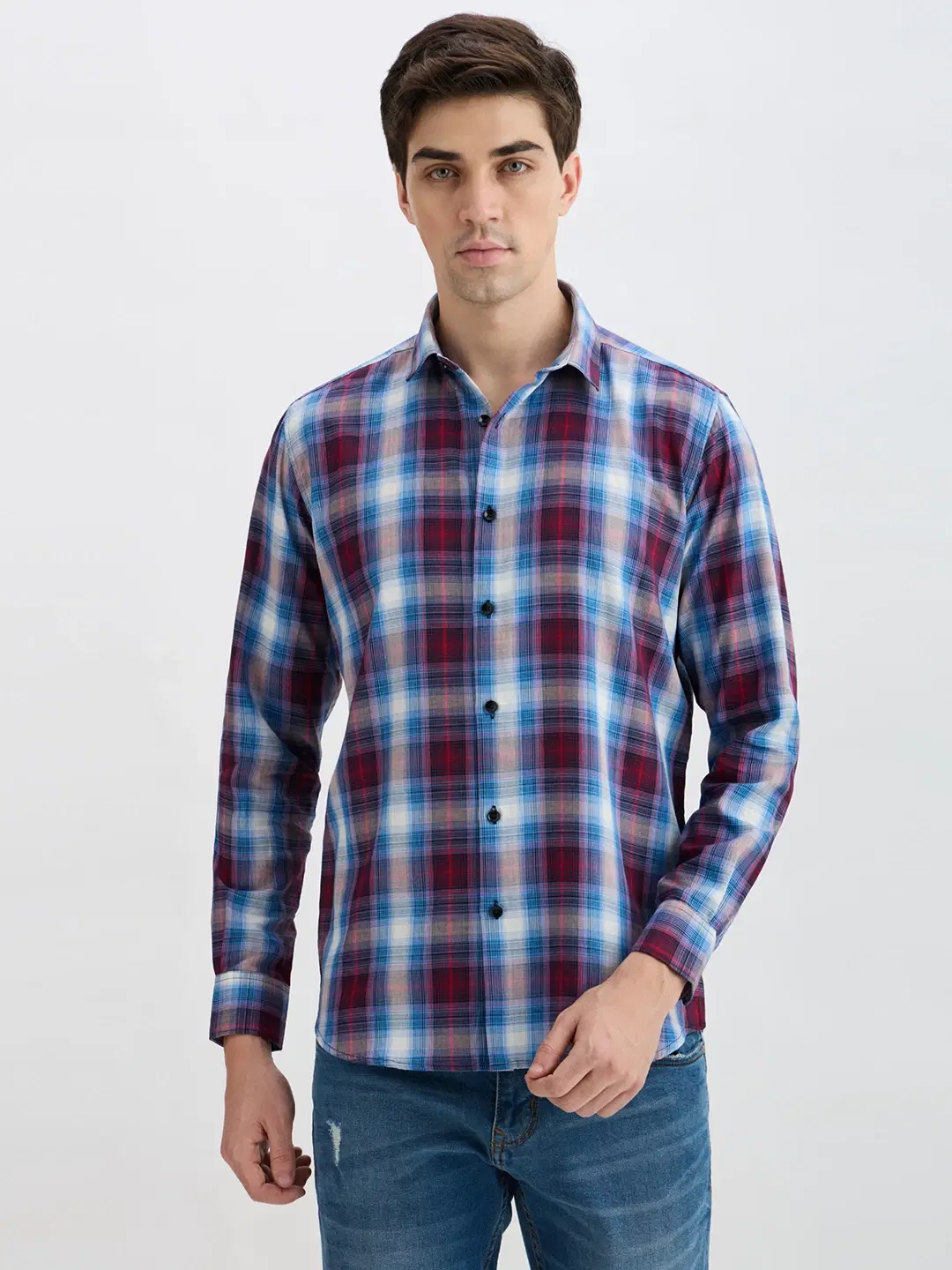 Front view of blue, maroon and white plaid shirt worn with sleeves down