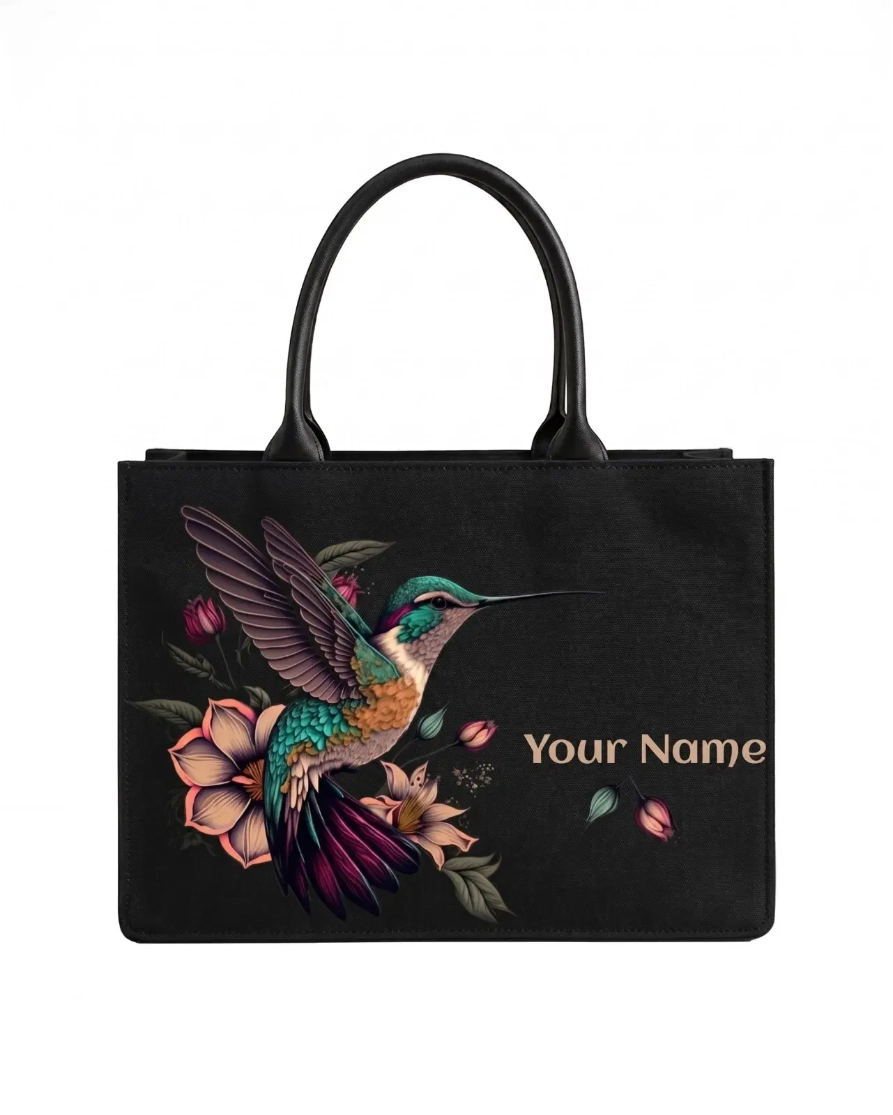 Front view of black tote bag with colorful hummingbird floral print and custom name text