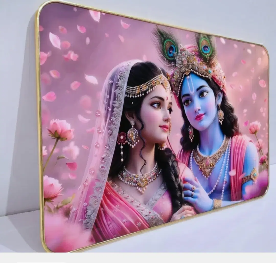 Angled front view of Radha Krishna wall art with pink floral background and slim gold border