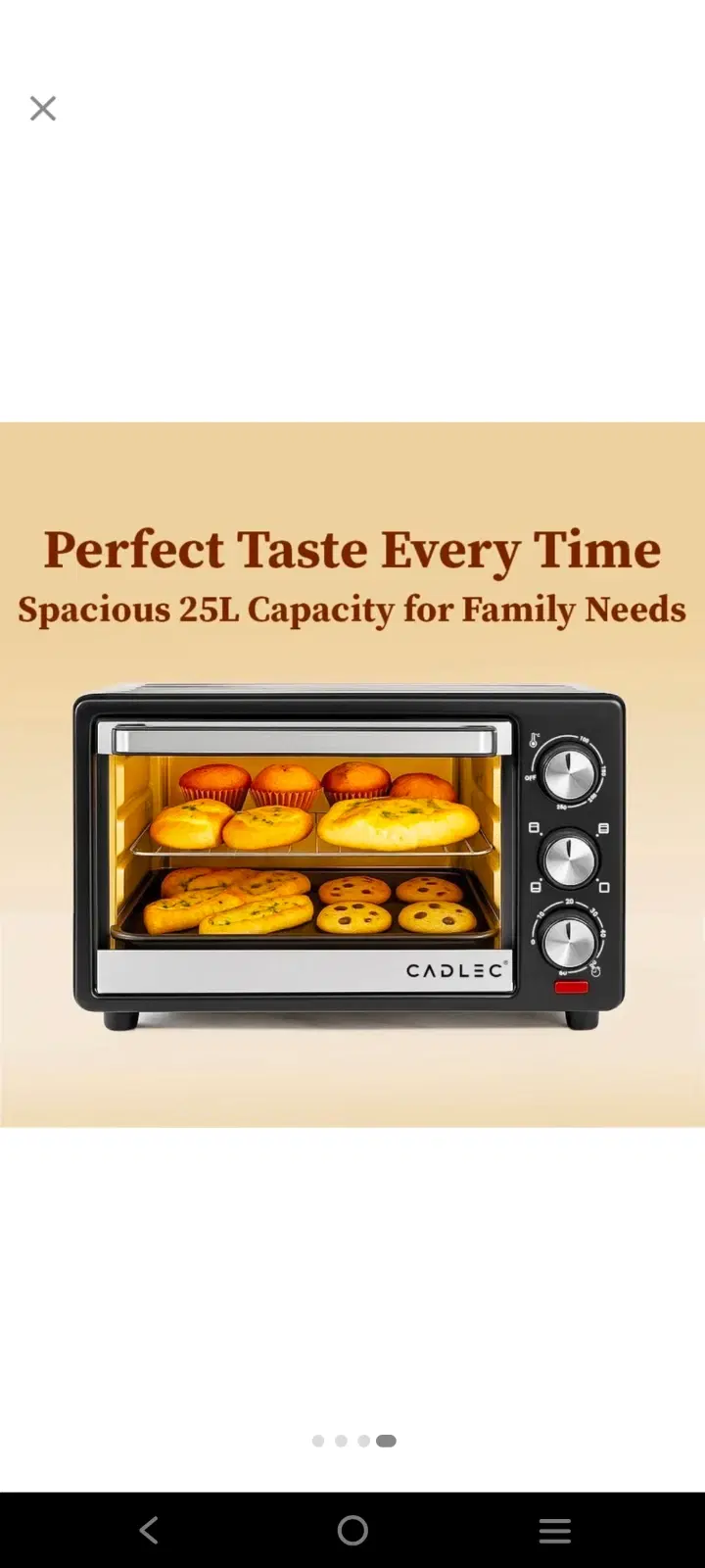 Front view of black 25L countertop oven with glass door, three silver knobs, and baked items inside