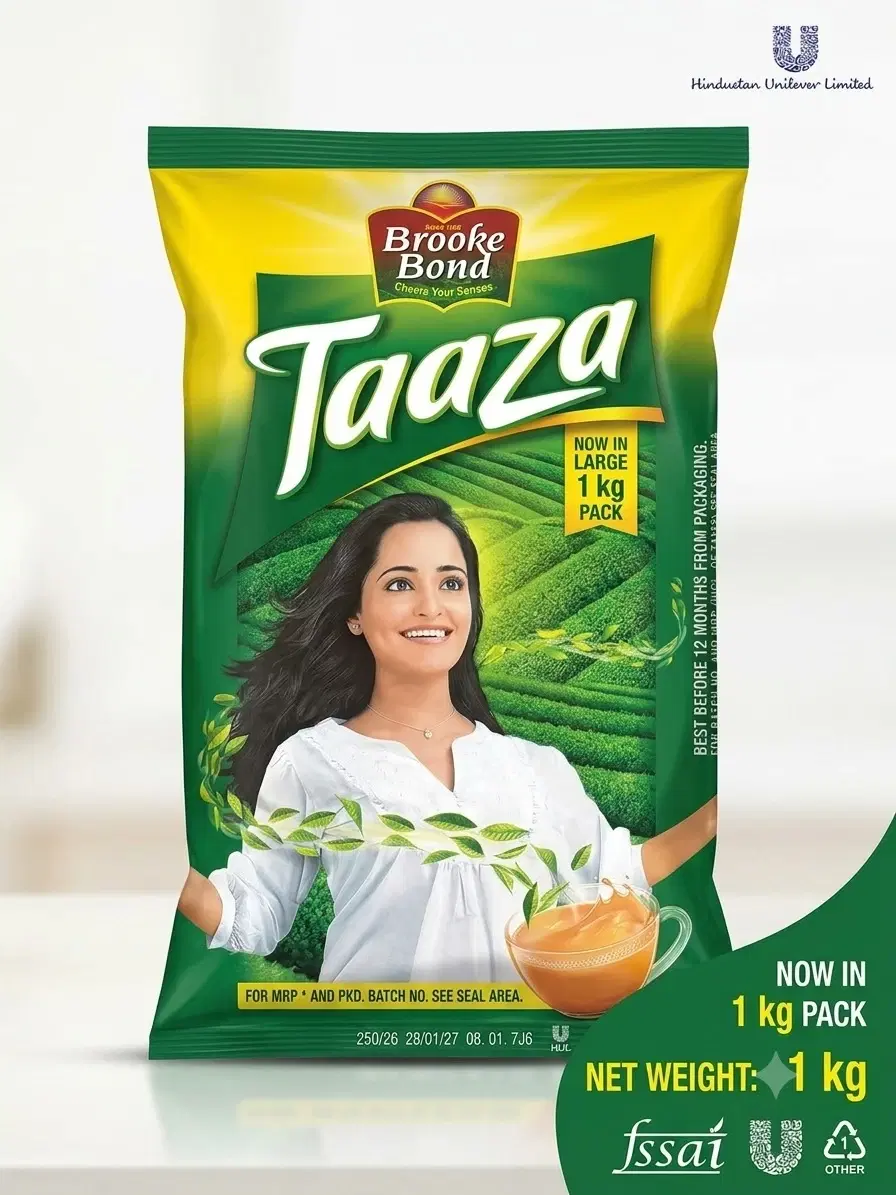 Front view of Brooke Bond Taaza tea 1 kg green and yellow pack with teacup graphic