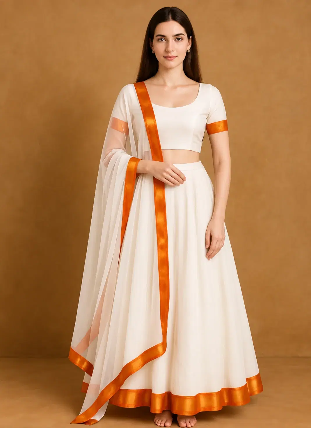 Front view of off-white lehenga set with flared skirt and sheer dupatta trimmed in orange border