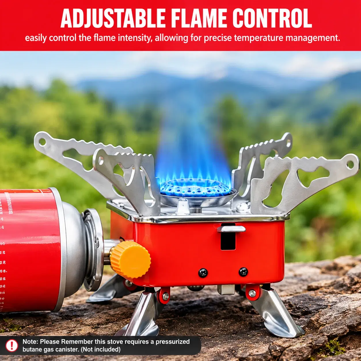 Red portable butane camping stove burning with blue flame beside a gas canister outdoors