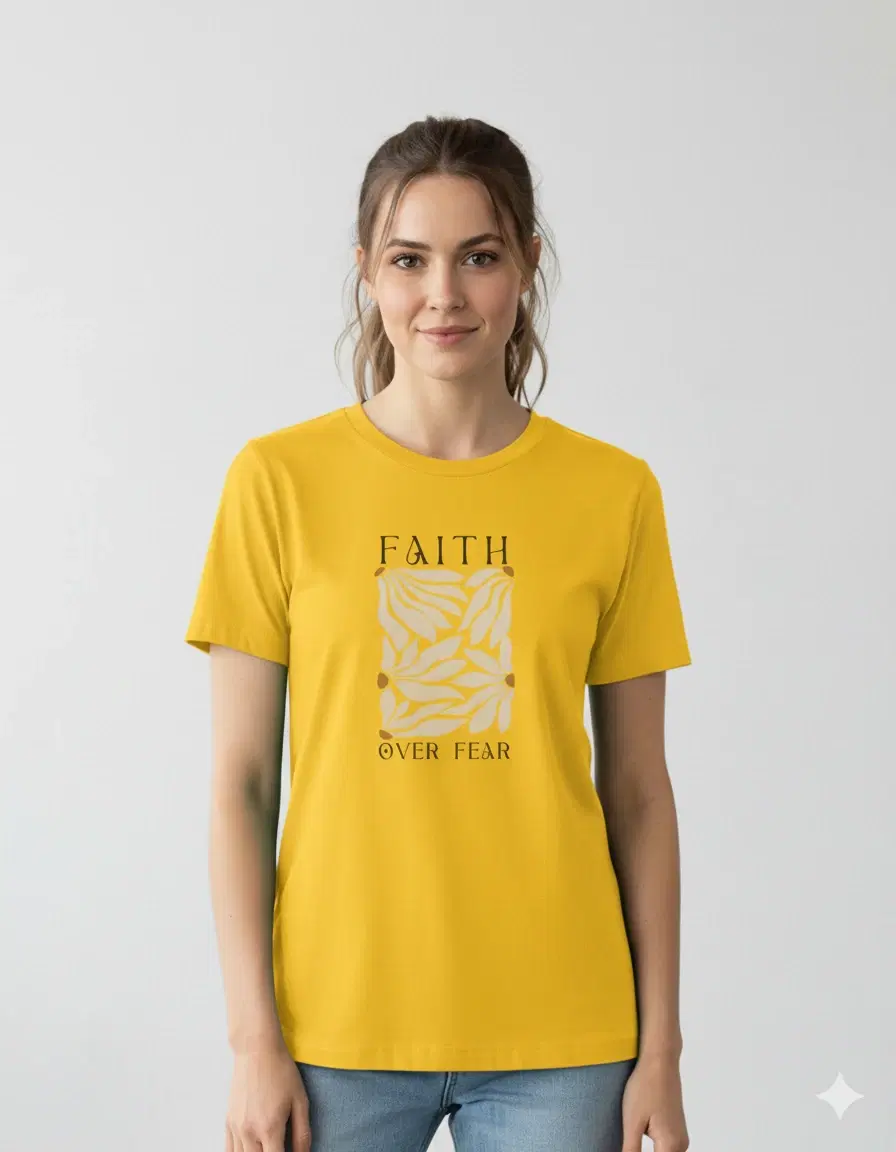 Woman wearing a yellow crew neck T-shirt with Faith Over Fear graphic print